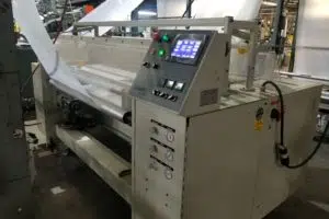 Industrial fabric rolling machine with touchscreen control